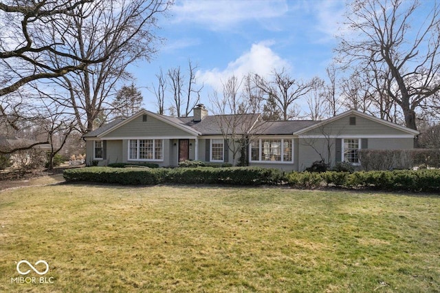 ranch-style home with a chimney and a front lawn