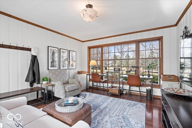 living area featuring ornamental molding and dark wood finished floors