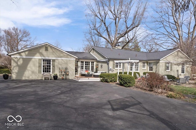 ranch-style house with a pergola