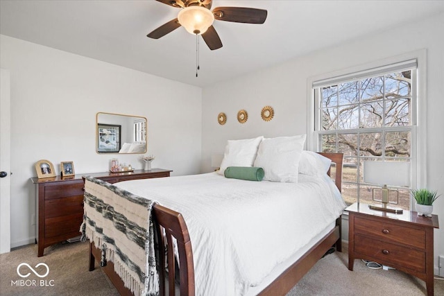 bedroom with light carpet and ceiling fan