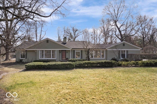 single story home featuring a chimney and a front yard