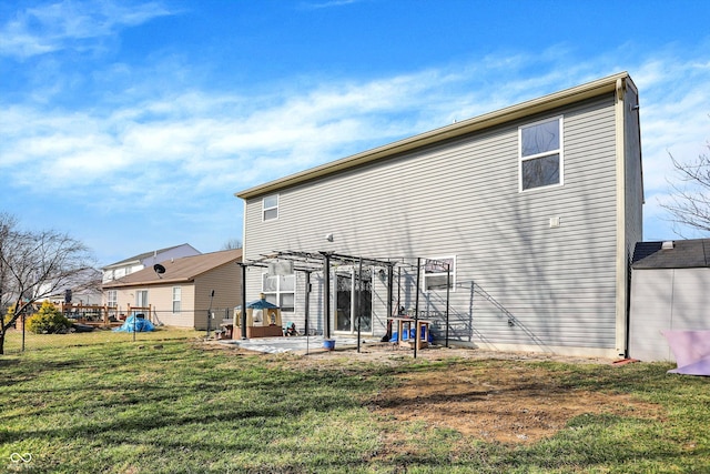 back of house with fence, a lawn, a patio, and a pergola