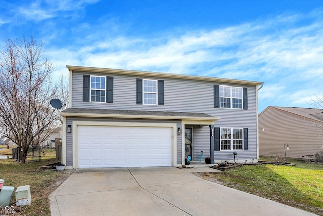 traditional home featuring an attached garage, concrete driveway, and a front lawn