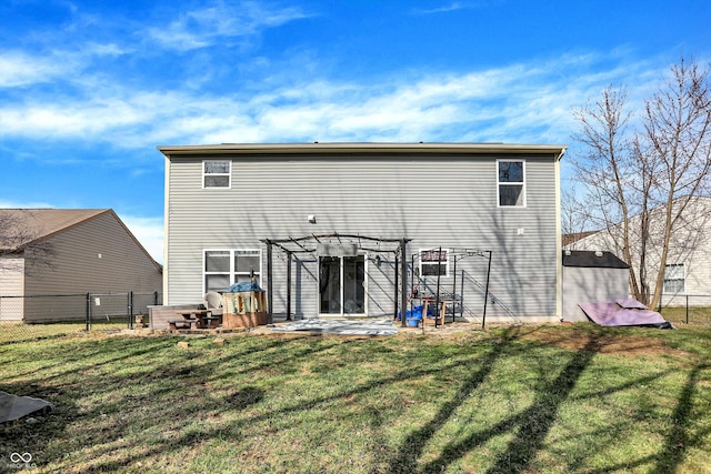 back of house with a patio, a yard, fence, and a pergola