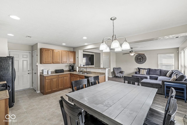 dining space with light tile patterned floors, recessed lighting, visible vents, and ceiling fan