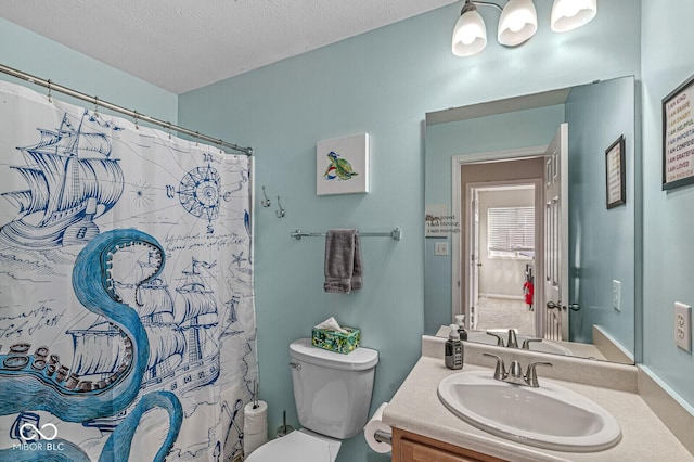 full bathroom with vanity, toilet, a shower with curtain, and a textured ceiling