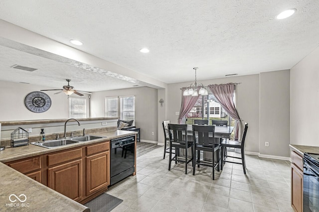 kitchen with visible vents, ceiling fan with notable chandelier, brown cabinetry, black appliances, and a sink