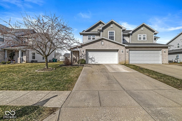 view of front of property featuring brick siding, an attached garage, concrete driveway, and a front yard