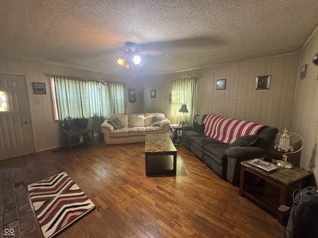 living room with wood finished floors and a textured ceiling