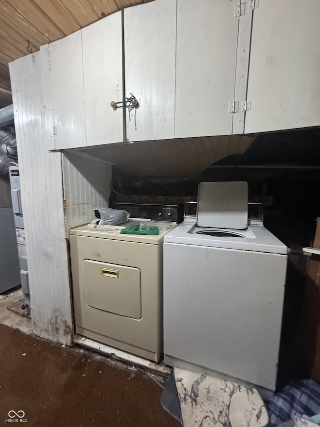 laundry area featuring cabinet space and separate washer and dryer