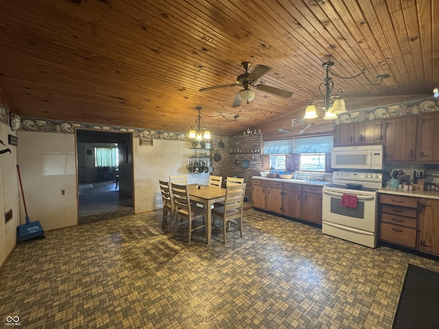 kitchen with decorative light fixtures, light countertops, vaulted ceiling, wooden ceiling, and white appliances