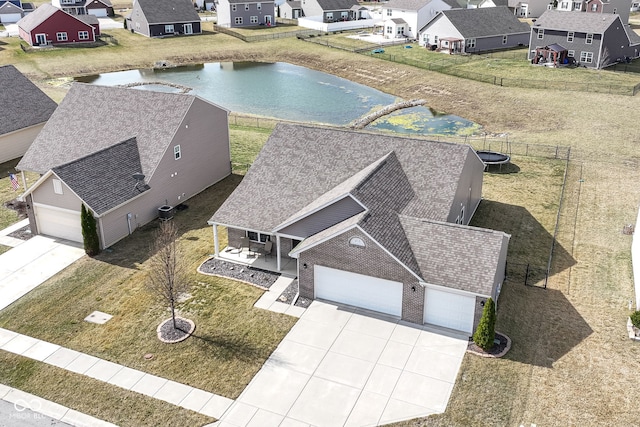 aerial view featuring a residential view and a water view