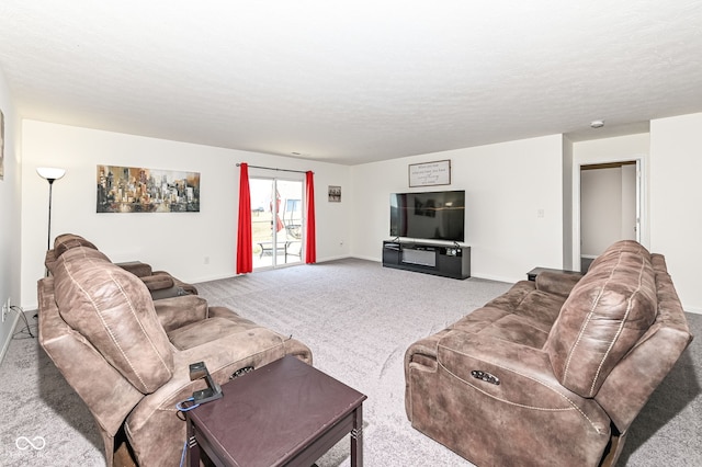 living room featuring baseboards, a textured ceiling, and carpet flooring