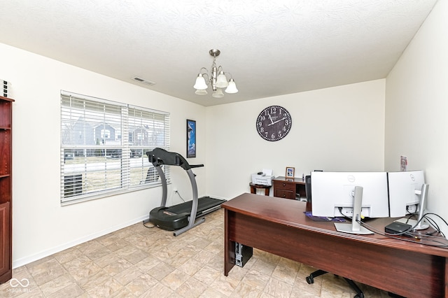 office space with visible vents, a textured ceiling, baseboards, and an inviting chandelier