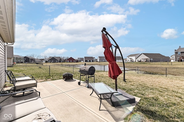 view of patio featuring a residential view and a fenced backyard