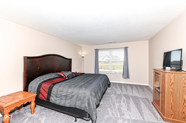 carpeted bedroom with baseboards