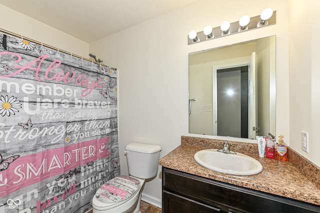 full bath featuring vanity, curtained shower, and toilet