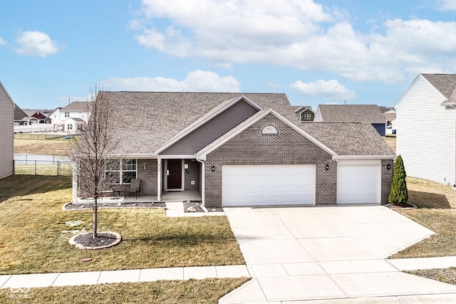 view of front facade featuring fence, covered porch, a front lawn, a garage, and brick siding