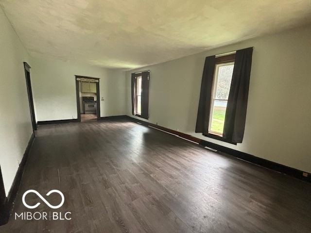 1713 Charles St, Lafayette, IN 47904 - unfurnished room with dark wood-style floors and baseboards