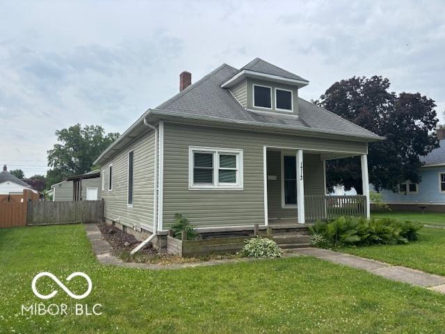 1713 Charles St, Lafayette, IN 47904 - bungalow-style home featuring a porch and a chimney