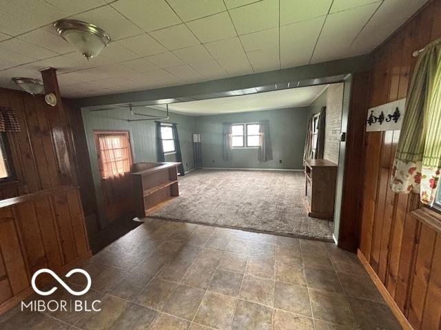 1713 Charles St, Lafayette, IN 47904 - unfurnished room featuring wood walls, carpet, and baseboards