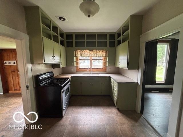 1713 Charles St, Lafayette, IN 47904 - kitchen featuring range with gas stovetop, open shelves, a sink, and light countertops