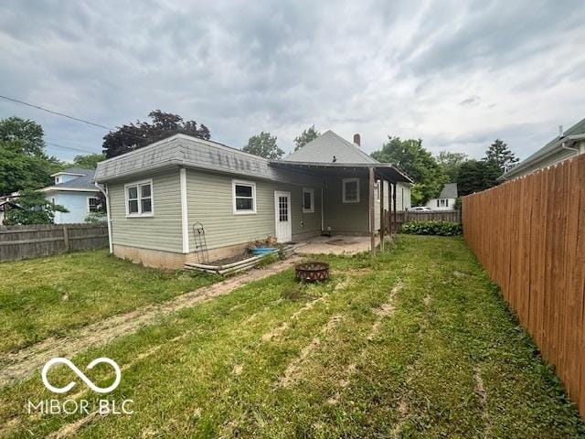 1713 Charles St, Lafayette, IN 47904 - back of property featuring an outdoor fire pit and a patio area