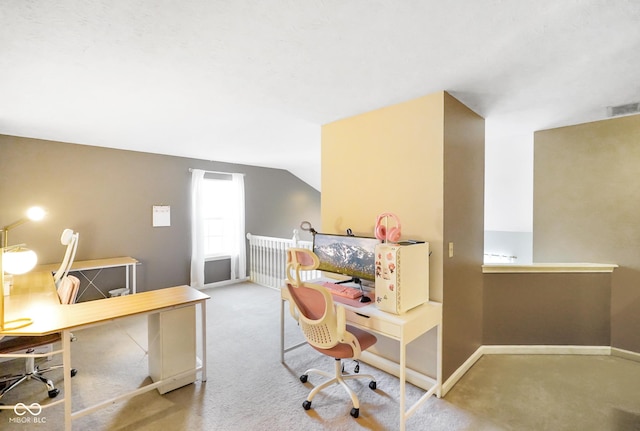 office area with vaulted ceiling, carpet, visible vents, and baseboards