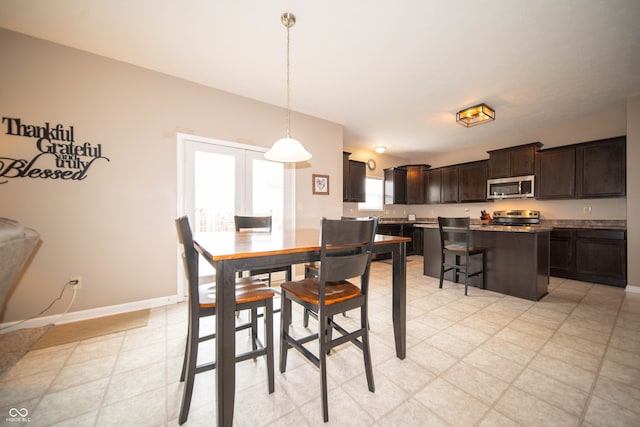 dining room featuring baseboards