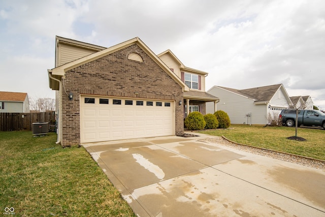 traditional home with cooling unit, driveway, an attached garage, a front lawn, and brick siding