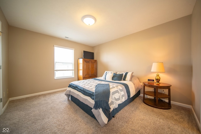 bedroom with baseboards, carpet floors, and visible vents