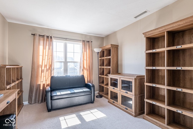 sitting room featuring visible vents and carpet flooring