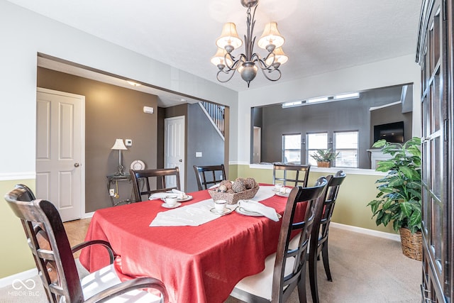 dining space with stairs, a notable chandelier, baseboards, and light carpet