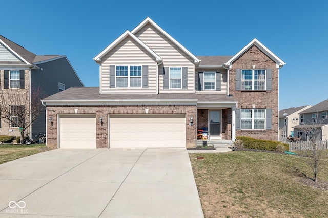 traditional-style house with a front yard, an attached garage, brick siding, and driveway