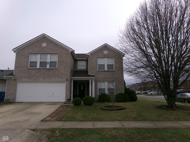 traditional home with brick siding, driveway, an attached garage, and a front lawn