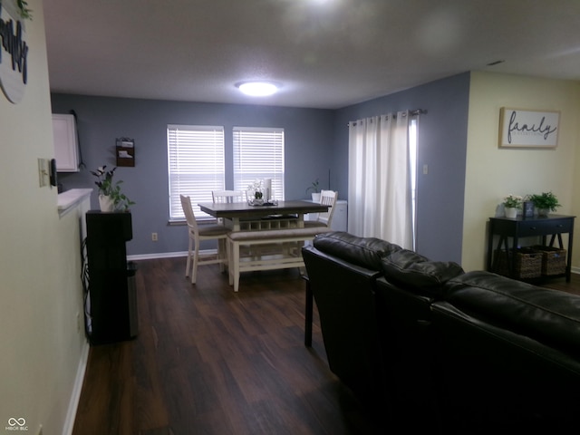 living area featuring dark wood finished floors and baseboards