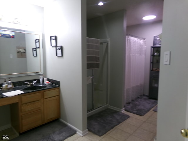 full bathroom with vanity, a shower with curtain, and baseboards