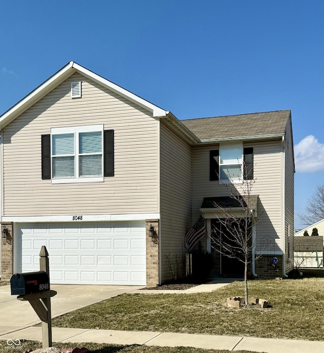 view of front of house with brick siding, a garage, and driveway