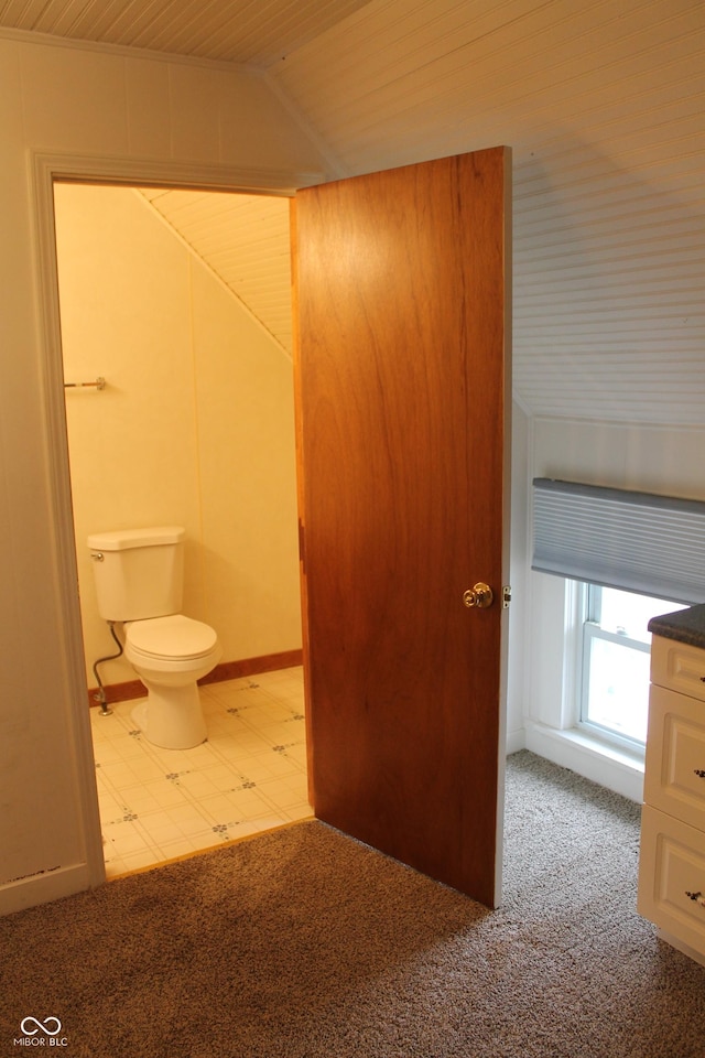 bathroom featuring lofted ceiling, toilet, and wood ceiling