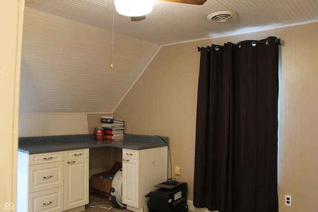 home office with lofted ceiling, crown molding, and visible vents