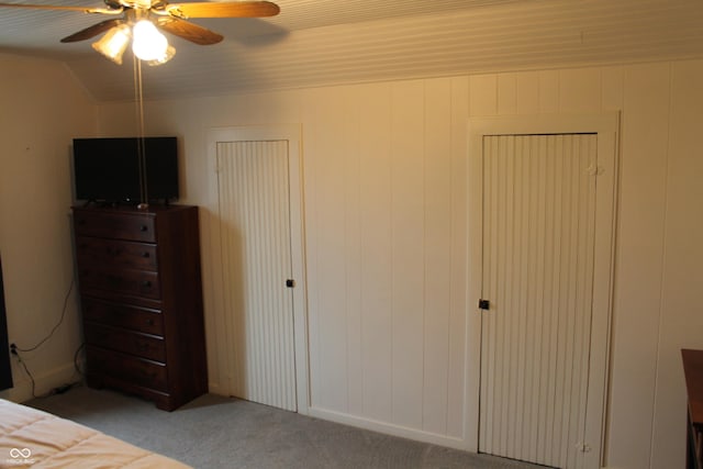 unfurnished bedroom with vaulted ceiling, carpet floors, and ceiling fan