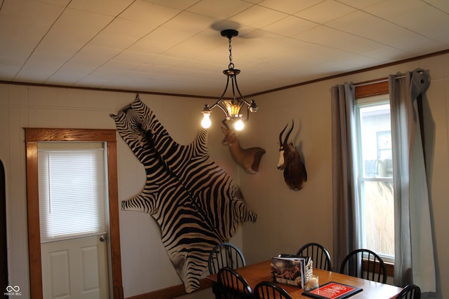 dining room featuring ornamental molding