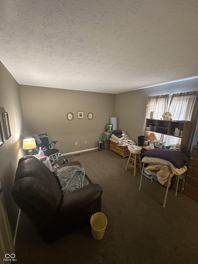 living area with baseboards, a textured ceiling, and carpet flooring