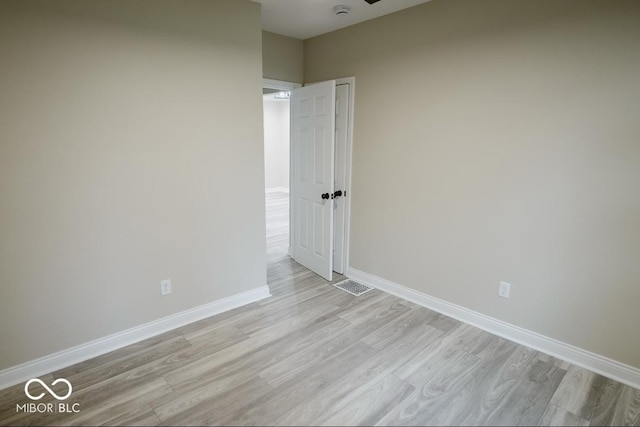 4504 Winthrop Ave, Indianapolis, IN 46205 - unfurnished room with baseboards, visible vents, and light wood-style flooring