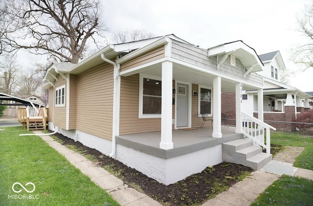 4504 Winthrop Ave, Indianapolis, IN 46205 - view of side of property featuring a lawn and covered porch