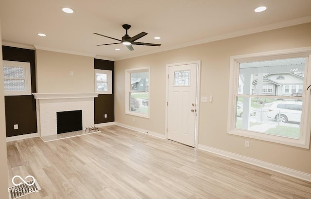 4504 Winthrop Ave, Indianapolis, IN 46205 - unfurnished living room with light wood-type flooring, a ceiling fan, baseboards, and ornamental molding