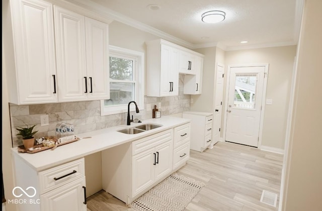 4504 Winthrop Ave, Indianapolis, IN 46205 - kitchen with visible vents, a sink, backsplash, and a healthy amount of sunlight