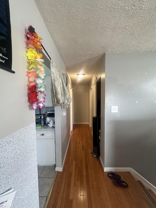 4930 Candy Spots Dr, Indianapolis, IN 46237 - hallway with a textured ceiling and hardwood / wood-style flooring