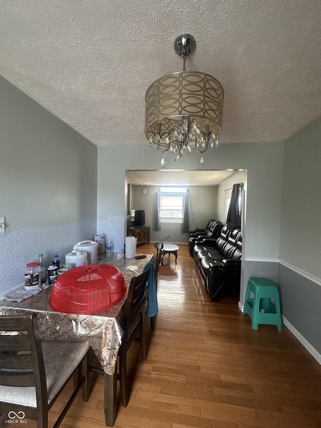 4930 Candy Spots Dr, Indianapolis, IN 46237 - dining room with a textured ceiling, hardwood / wood-style flooring, and a chandelier