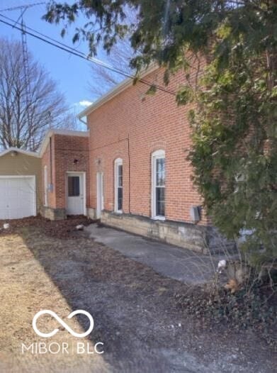 635 W Pearl St, Union City, IN 47390 - view of side of property with brick siding